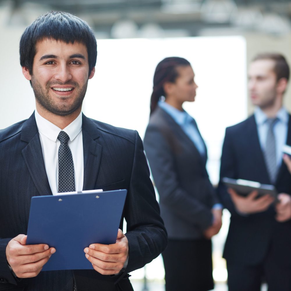 competitive-businessman-holding-clipboard-scaled.jpg